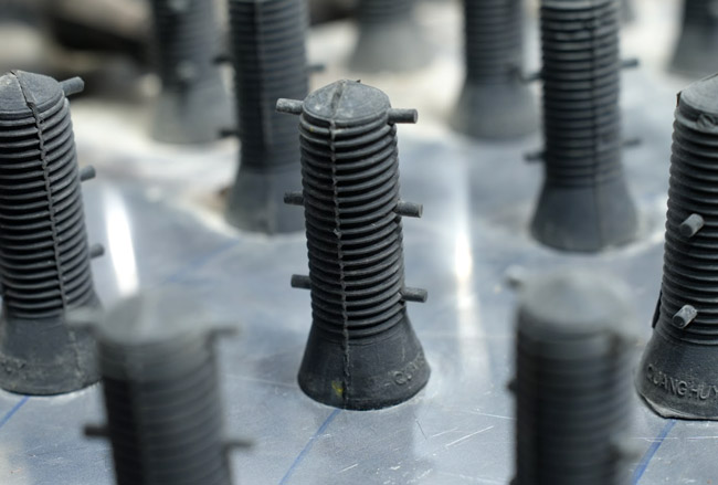 Núm cao su máy làm lông dê